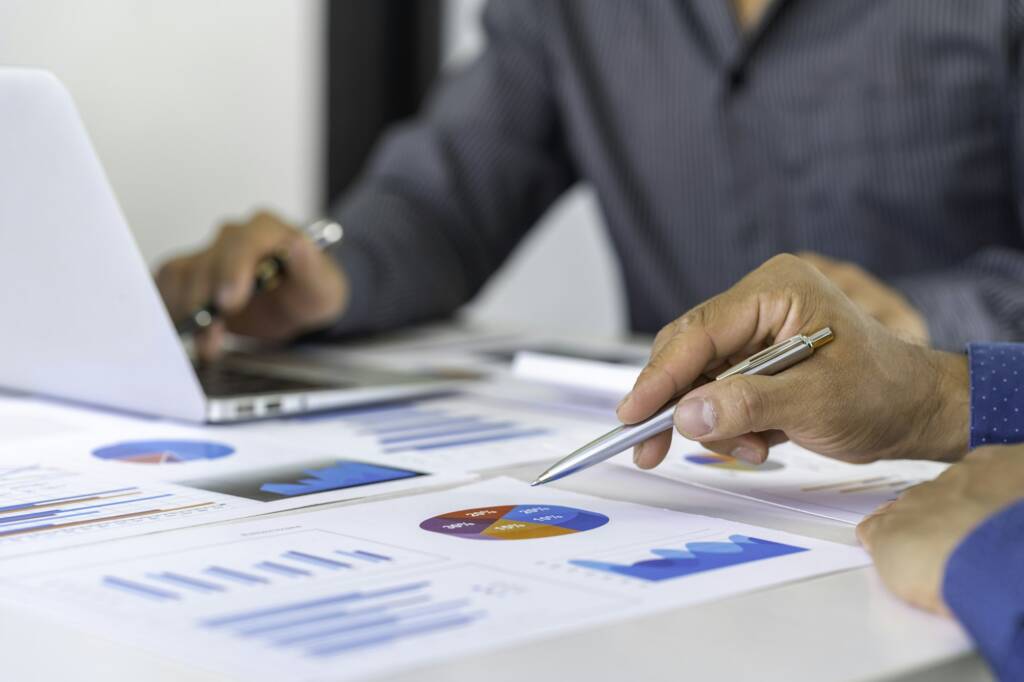 Business people discussing working analyzing with financial data and marketing business strategy pro